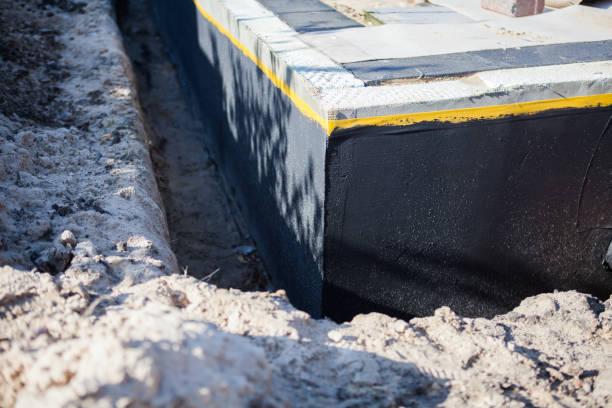 Professional Exterior Waterproofing technician working in Nashville, KS